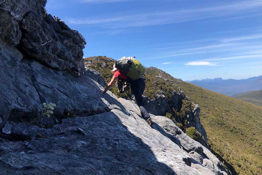 skirting-a-rocky-outcrop Image of julie skirting a rocky outcrop